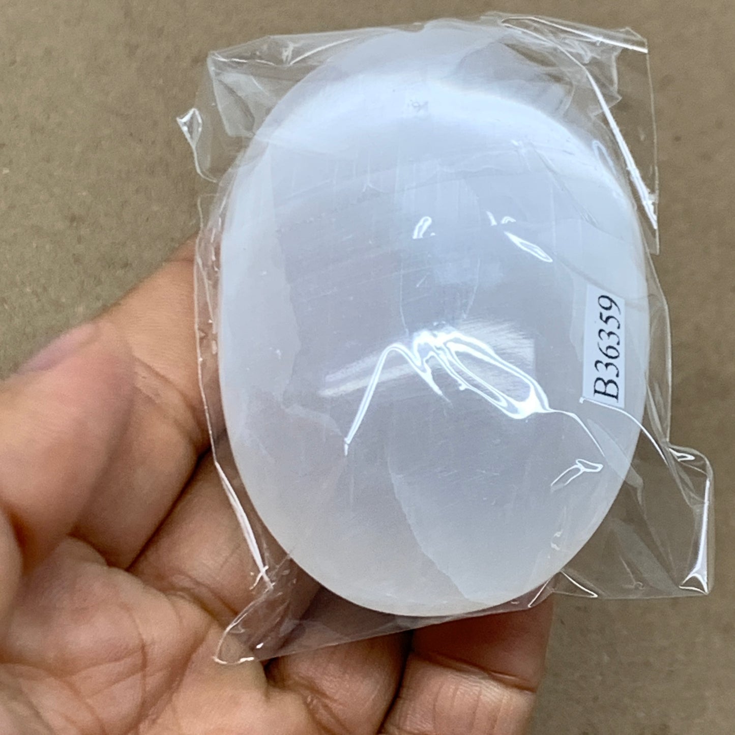 97g, 2.7"x1.9"x1", White Selenite Palmstone Crystal Pillow Reiki, B36359