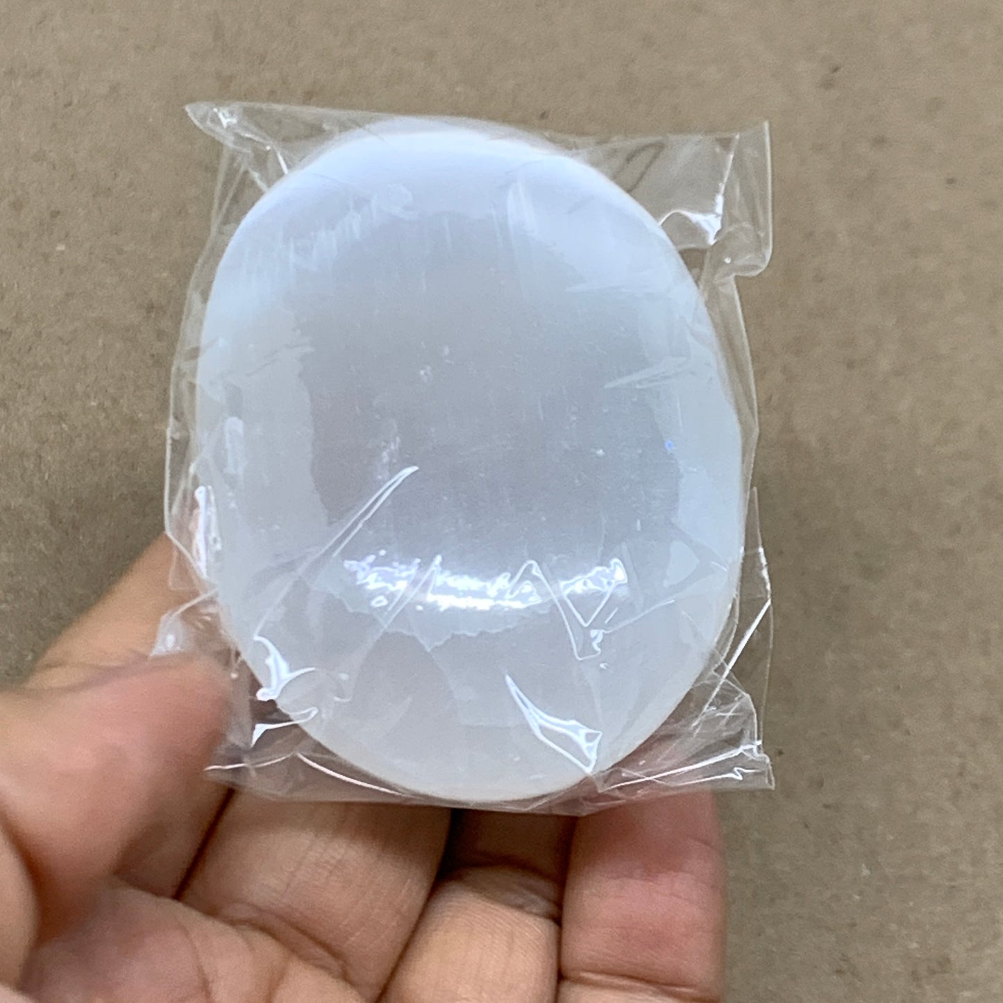 97g, 2.7"x1.9"x1", White Selenite Palmstone Crystal Pillow Reiki, B36359