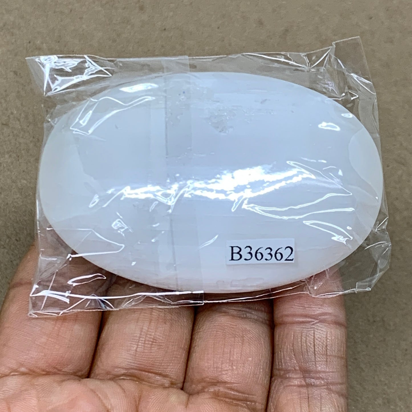 83g, 2.8"x1.9"x0.8", White Selenite Palmstone Crystal Pillow Reiki, B36362