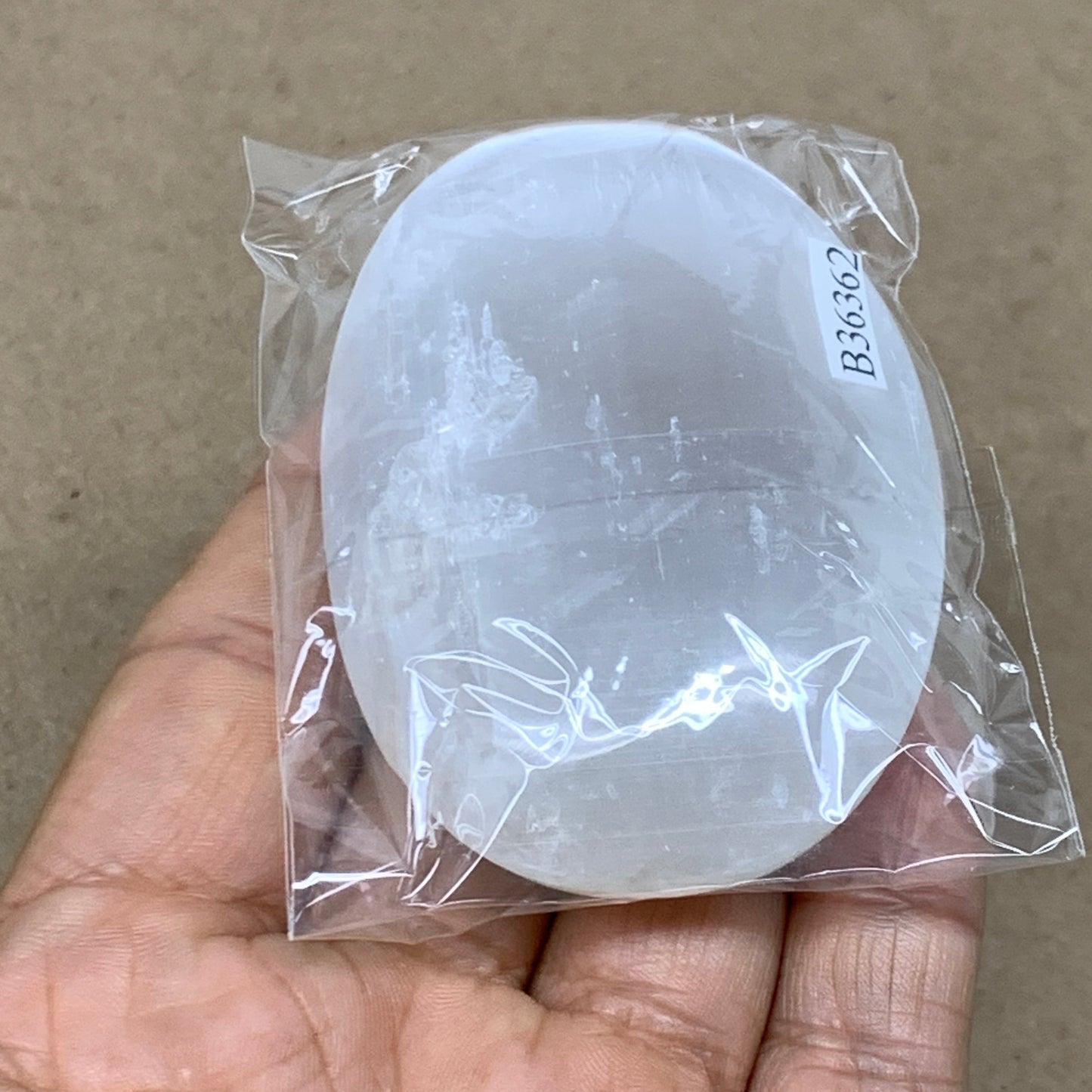 83g, 2.8"x1.9"x0.8", White Selenite Palmstone Crystal Pillow Reiki, B36362