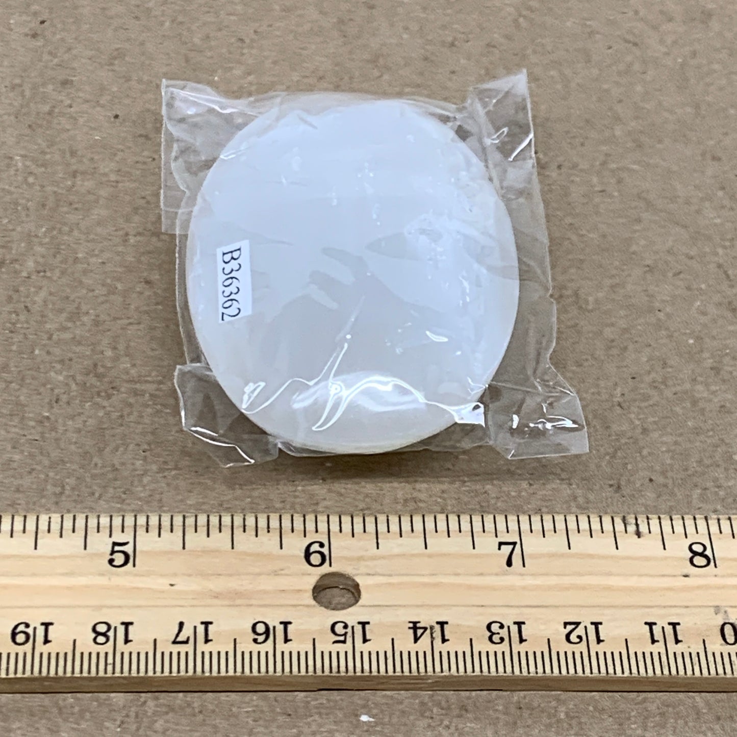 83g, 2.8"x1.9"x0.8", White Selenite Palmstone Crystal Pillow Reiki, B36362