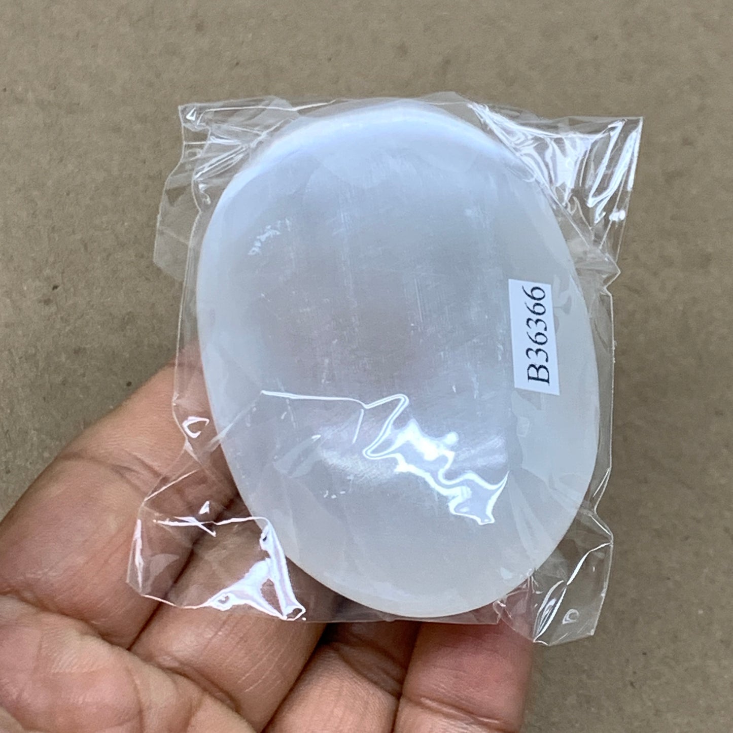 91g, 2.8"x1.9"x0.9", White Selenite Palmstone Crystal Pillow Reiki, B36366