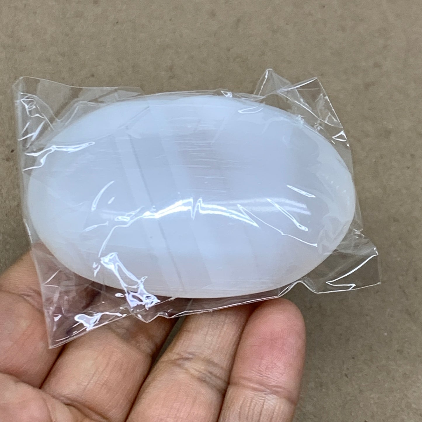 91g, 2.8"x1.9"x0.9", White Selenite Palmstone Crystal Pillow Reiki, B36366