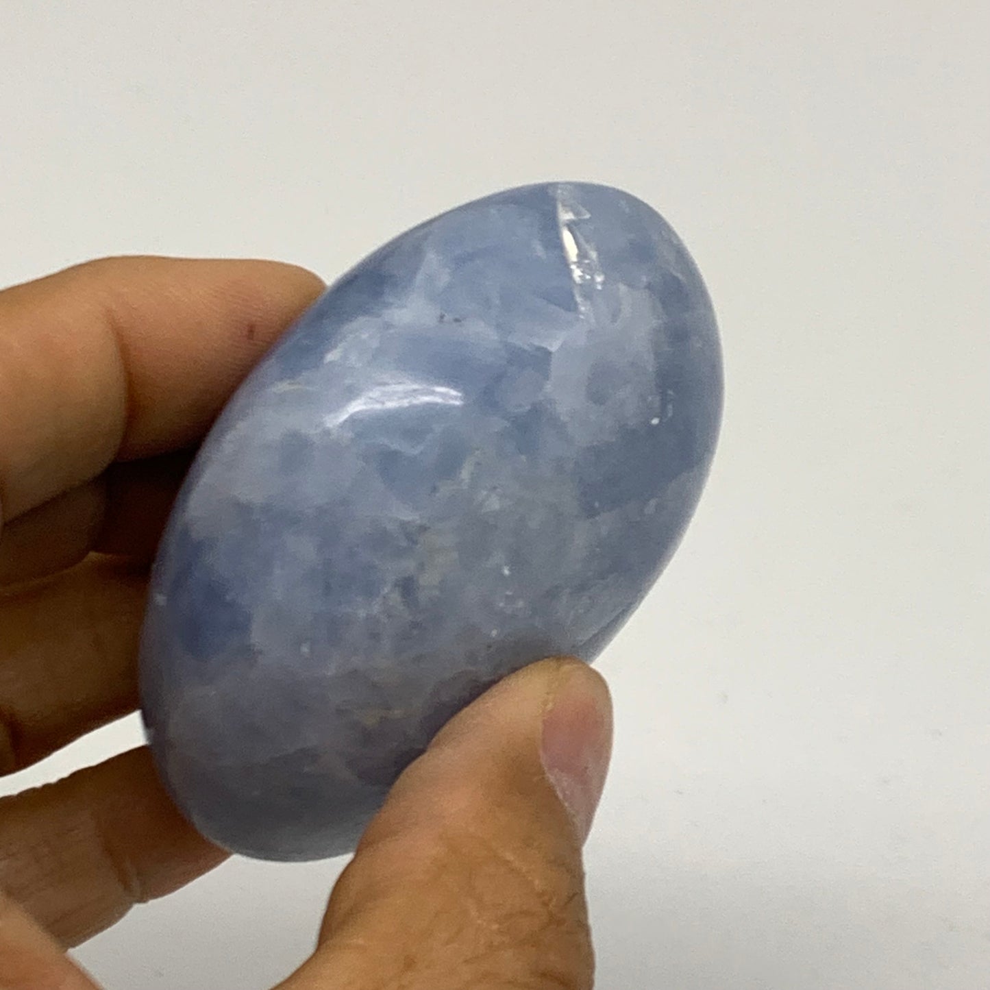144.1g, 2.5"x2.1"x1.2" Blue Calcite Palm-Stone Polished Tumbled, B38121