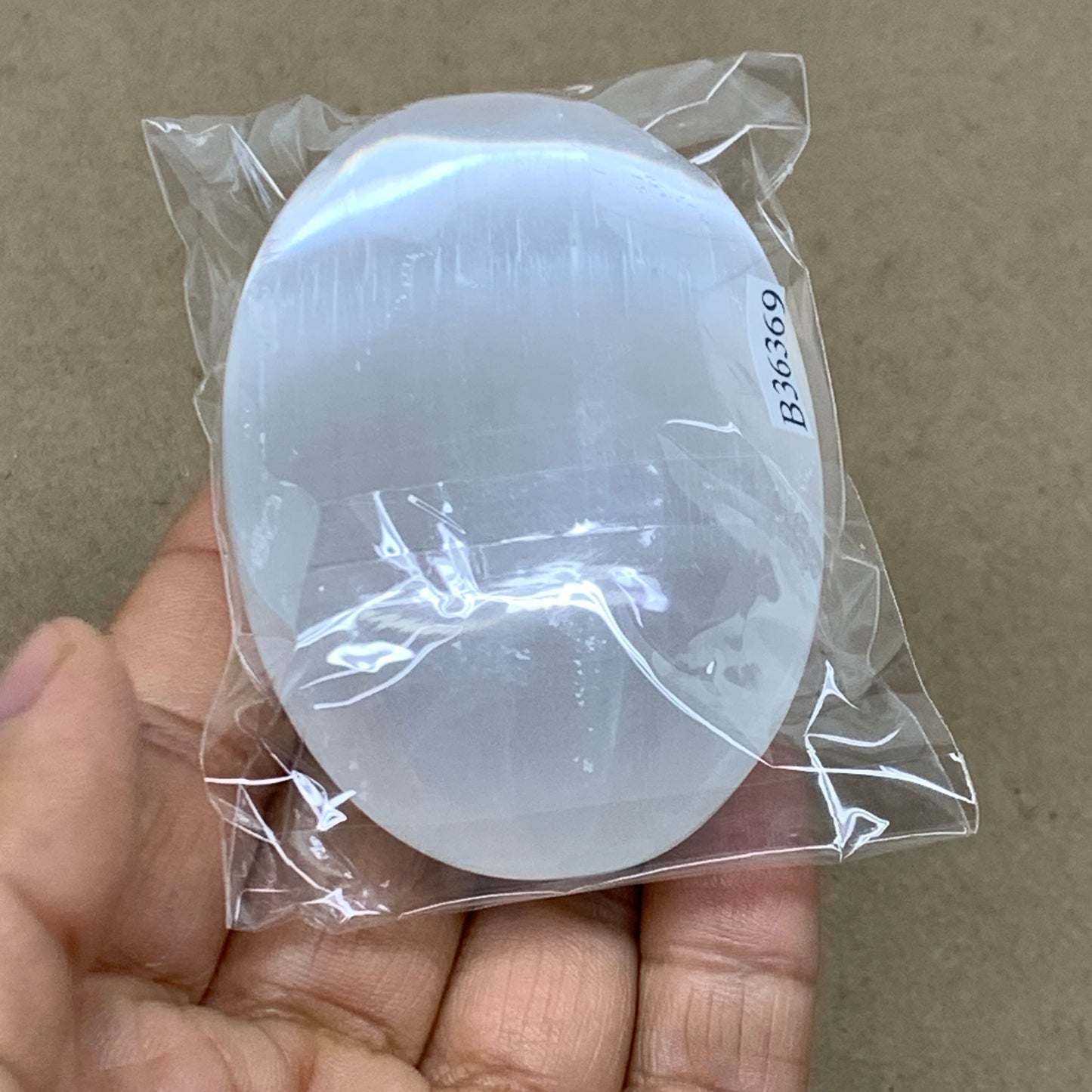 96g, 2.8"x1.8"x0.9", White Selenite Palmstone Crystal Pillow Reiki, B36369