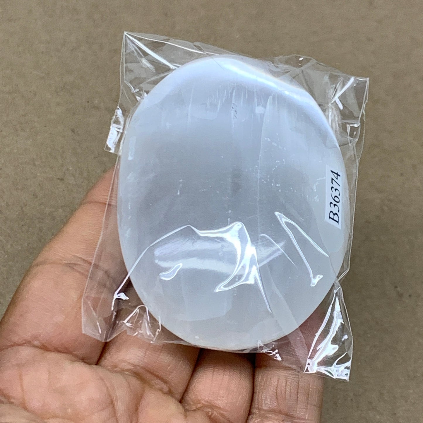 97g, 2.8"x2"x0.9", White Selenite Palmstone Crystal Pillow Reiki, B36374