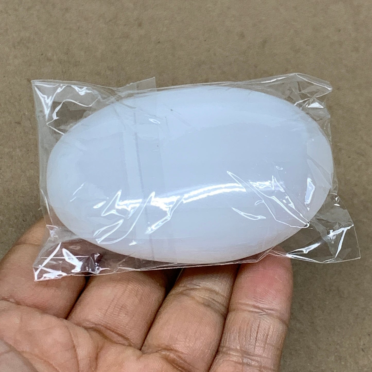 97g, 2.8"x2"x0.9", White Selenite Palmstone Crystal Pillow Reiki, B36374