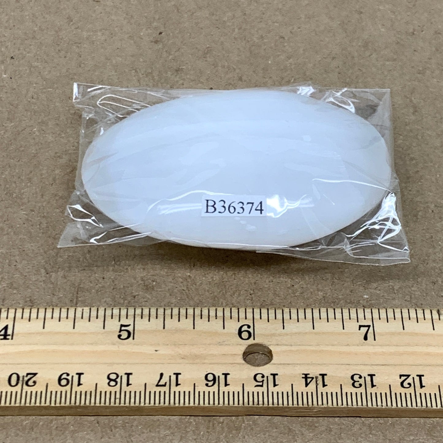 97g, 2.8"x2"x0.9", White Selenite Palmstone Crystal Pillow Reiki, B36374
