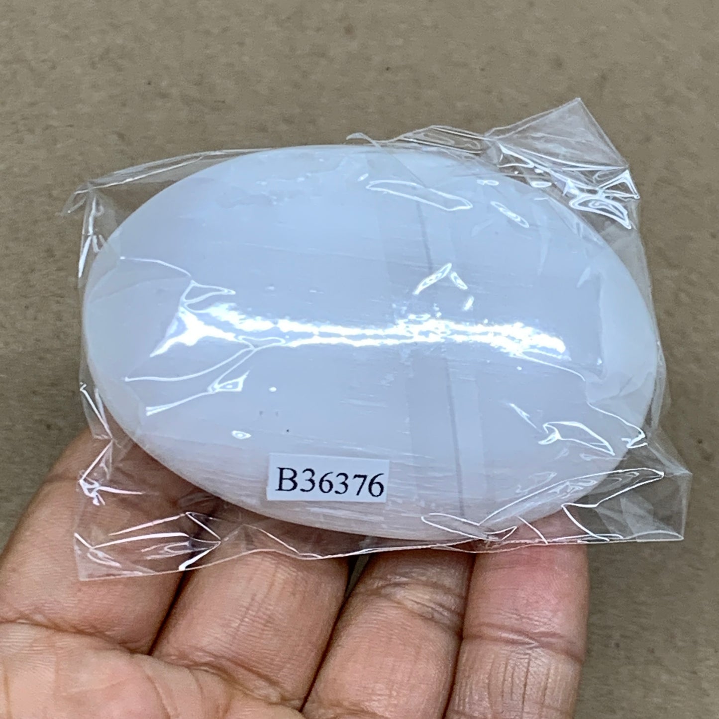 93g, 2.8"x1.9"x0.9", White Selenite Palmstone Crystal Pillow Reiki, B36376