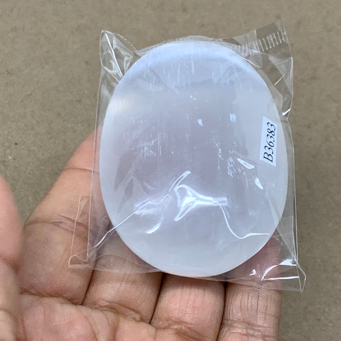 94g, 2.7"x2"x0.9", White Selenite Palmstone Crystal Pillow Reiki, B36383