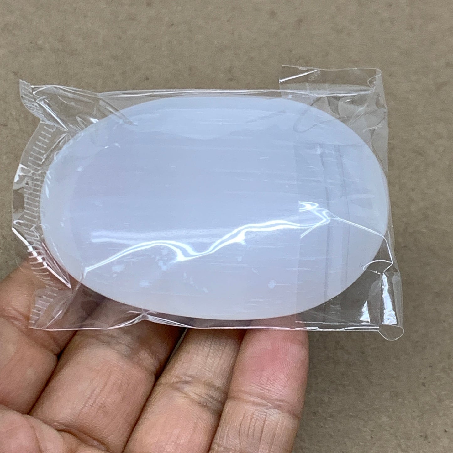 94g, 2.7"x2"x0.9", White Selenite Palmstone Crystal Pillow Reiki, B36383