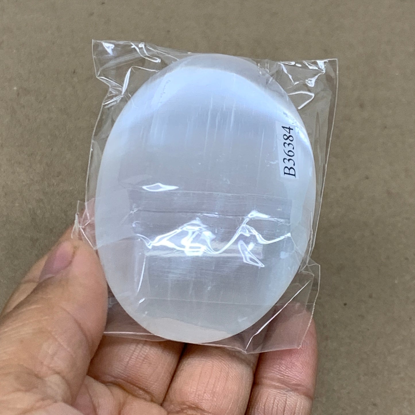 93g, 2.8"x1.9"x0.9", White Selenite Palmstone Crystal Pillow Reiki, B36384