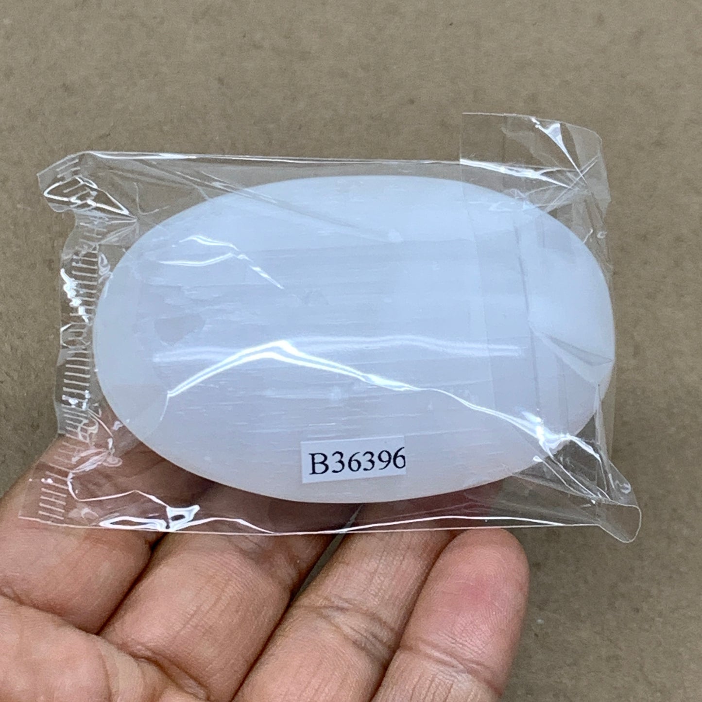 88g, 2.8"x1.9"x0.9", White Selenite Palmstone Crystal Pillow Reiki, B36396