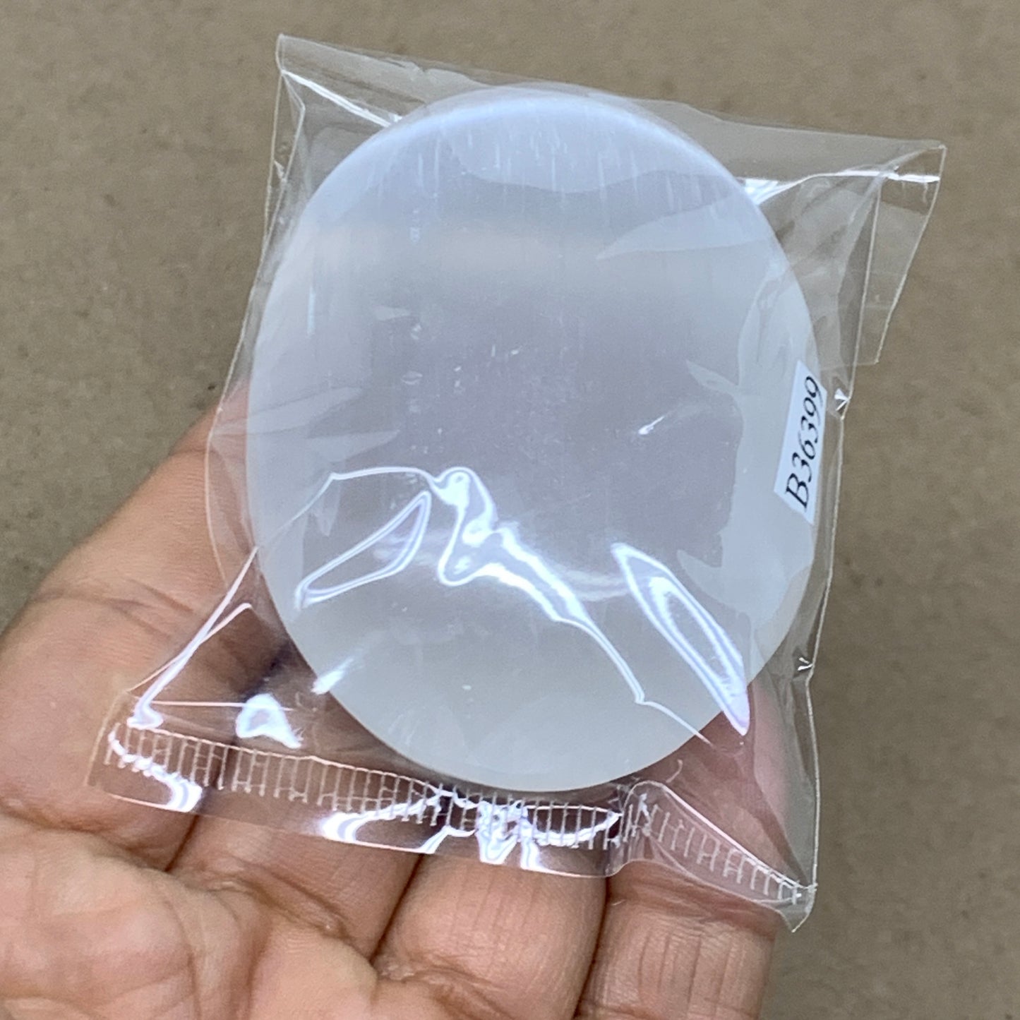 91g, 2.7"x1.9"x0.9", White Selenite Palmstone Crystal Pillow Reiki, B36399