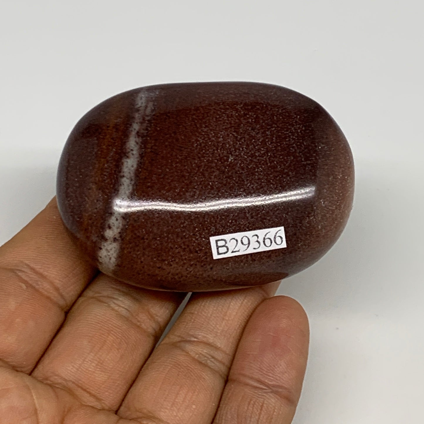 108.3g, 2.4"x1.7"x1", Narmada Shiva Lingam Palm-Stone Polished, B29366