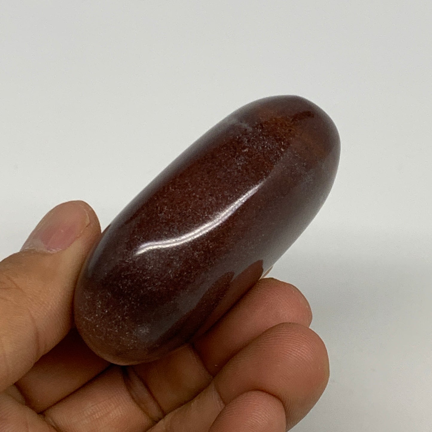 108.3g, 2.4"x1.7"x1", Narmada Shiva Lingam Palm-Stone Polished, B29366