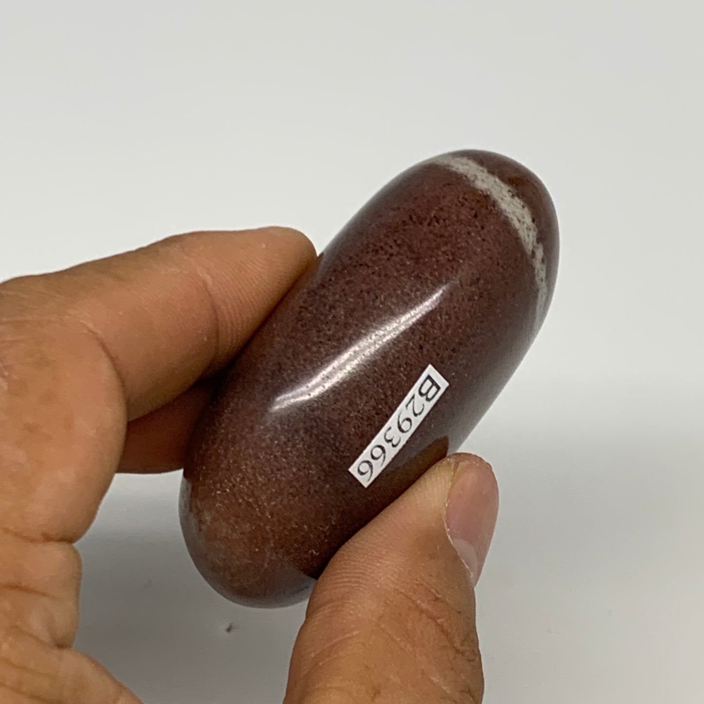 108.3g, 2.4"x1.7"x1", Narmada Shiva Lingam Palm-Stone Polished, B29366