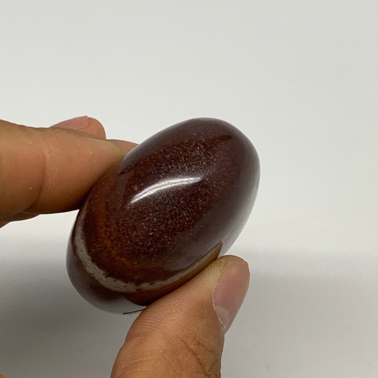 108.3g, 2.4"x1.7"x1", Narmada Shiva Lingam Palm-Stone Polished, B29366