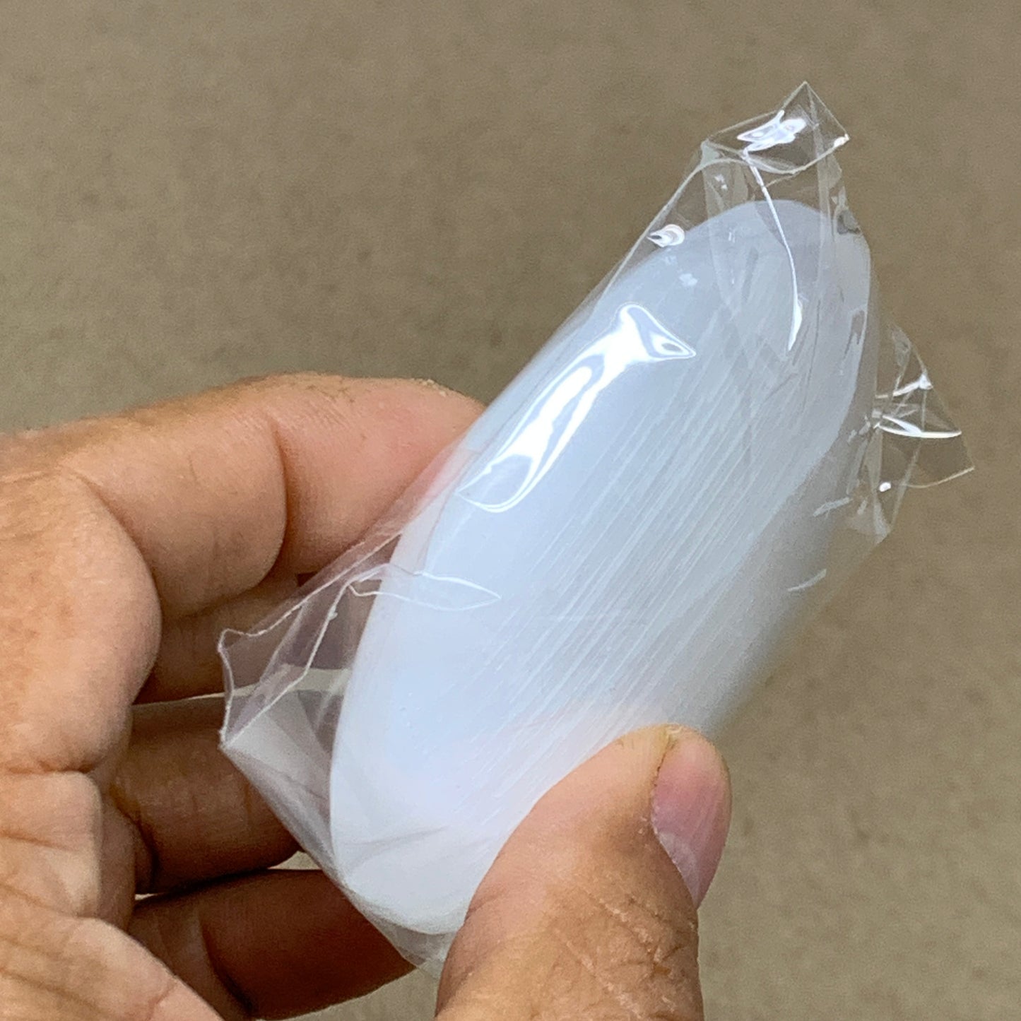 91g, 2.8"x2x0.9", White Selenite Palmstone Crystal Pillow Reiki, B36411