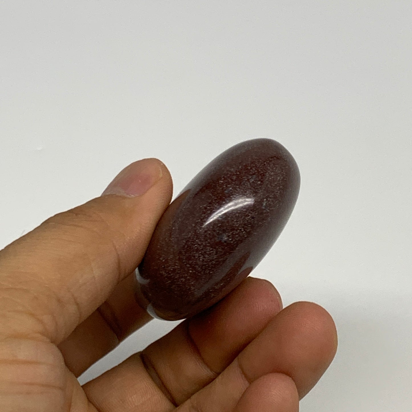 96g, 2.3"x1.8"x0.9", Narmada Shiva Lingam Palm-Stone Polished, B29361