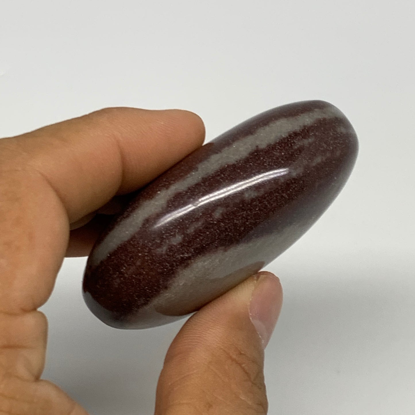 107.3g, 2.4"x1.8"x1", Narmada Shiva Lingam Palm-Stone Polished, B29370