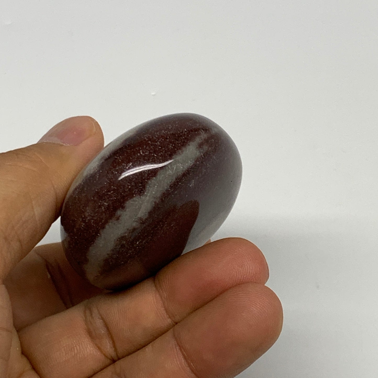 107.3g, 2.4"x1.8"x1", Narmada Shiva Lingam Palm-Stone Polished, B29370