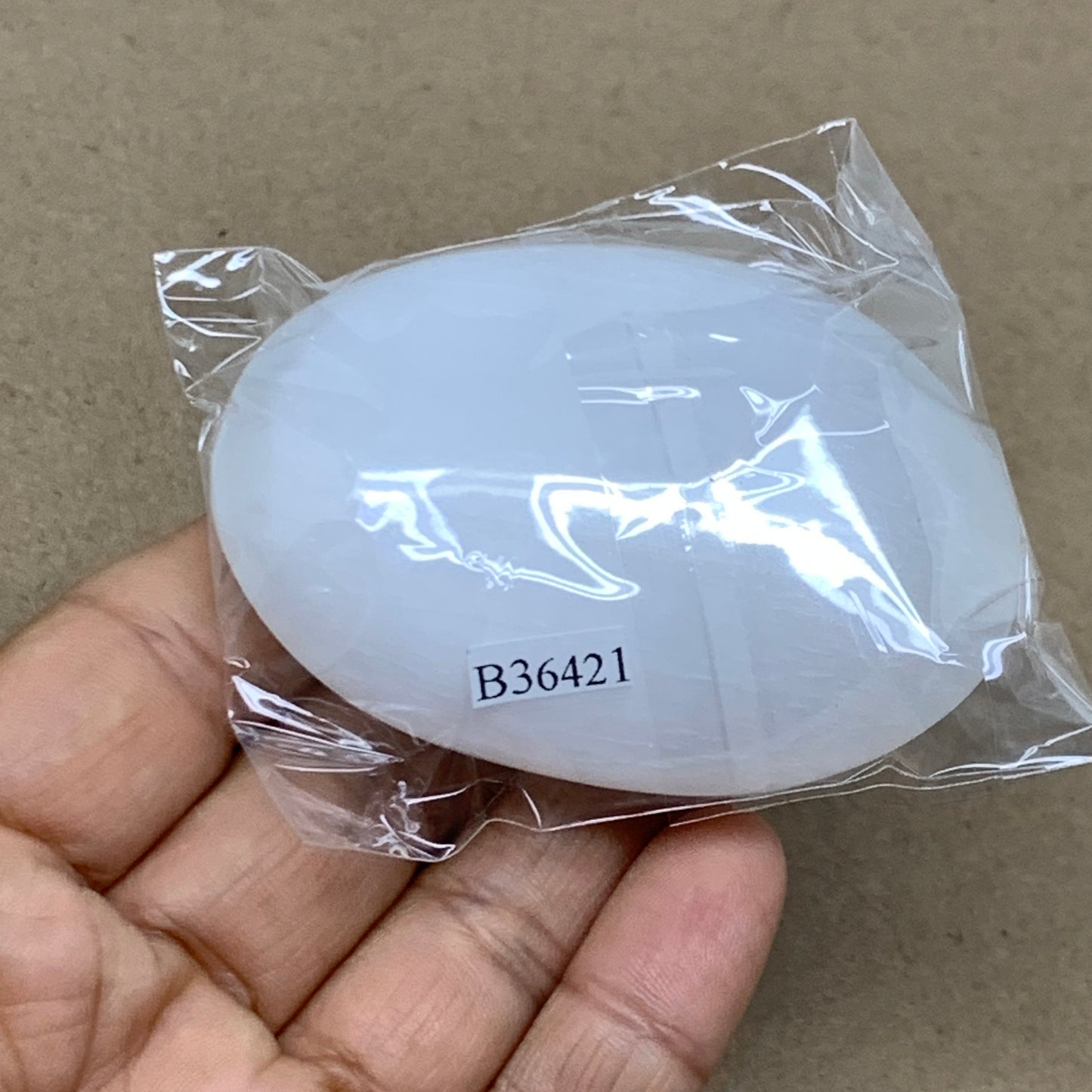 88g, 2.7"x1.9"x0.9", White Selenite Palmstone Crystal Pillow Reiki, B36421