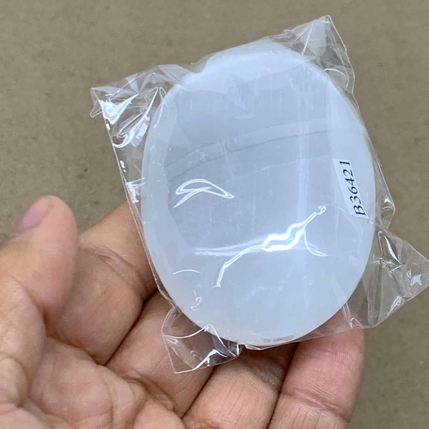 88g, 2.7"x1.9"x0.9", White Selenite Palmstone Crystal Pillow Reiki, B36421