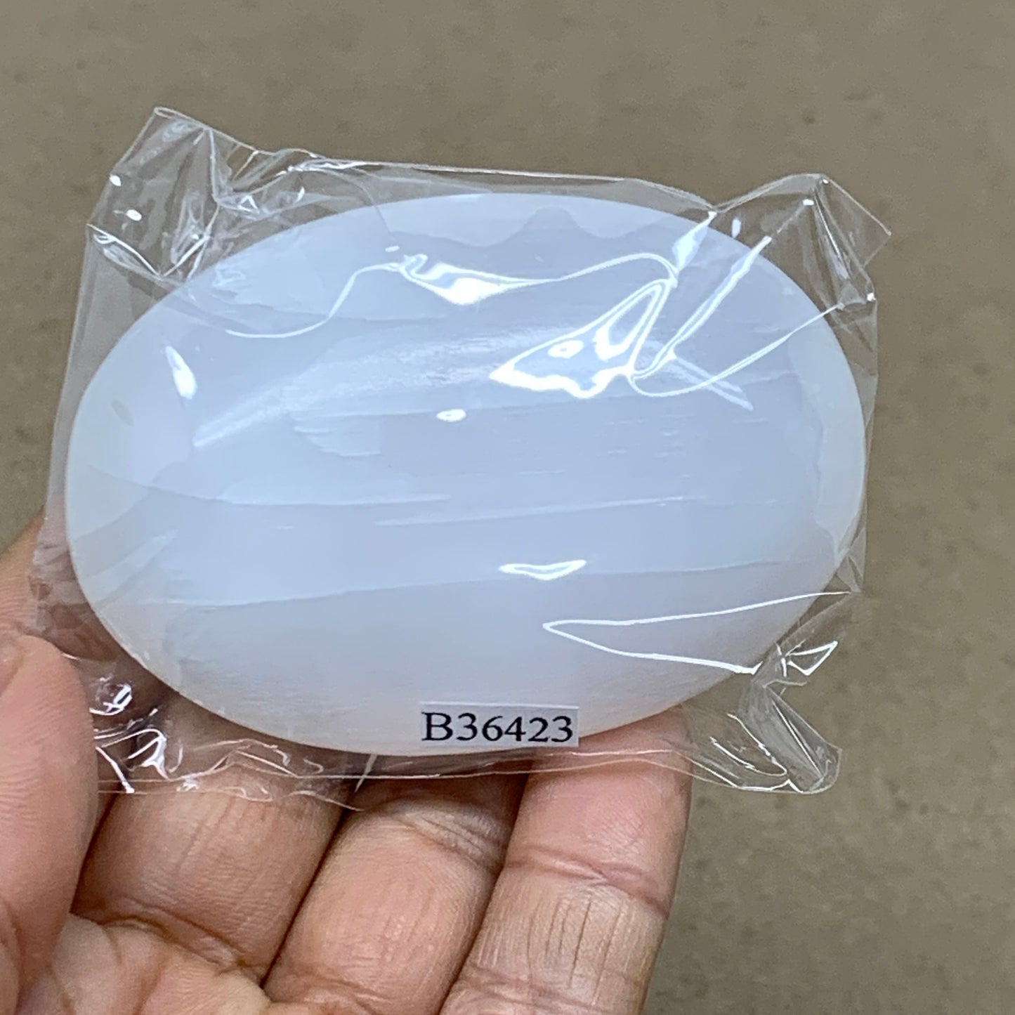 88g, 2.7"x1.9"x0.9", White Selenite Palmstone Crystal Pillow Reiki, B36423