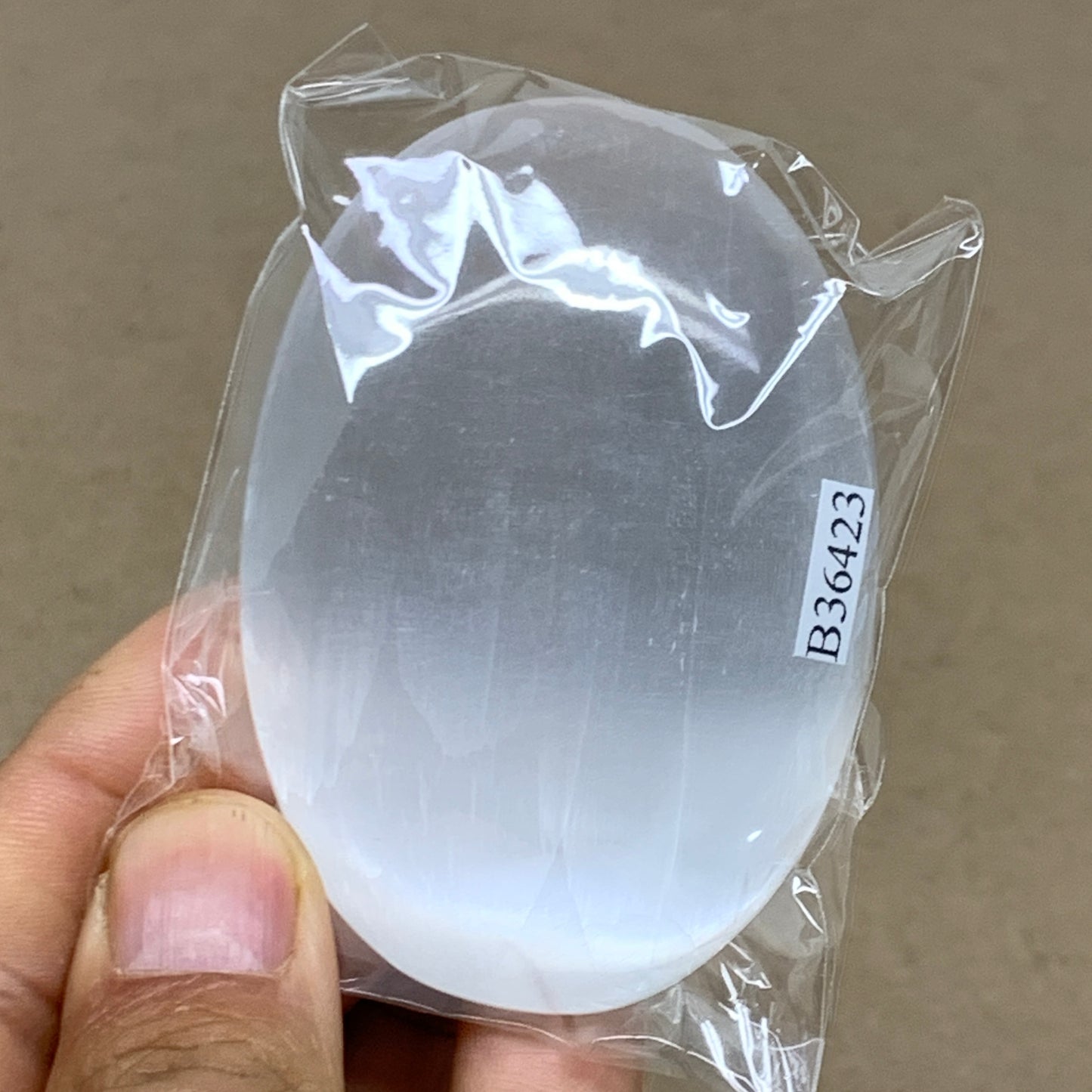 88g, 2.7"x1.9"x0.9", White Selenite Palmstone Crystal Pillow Reiki, B36423