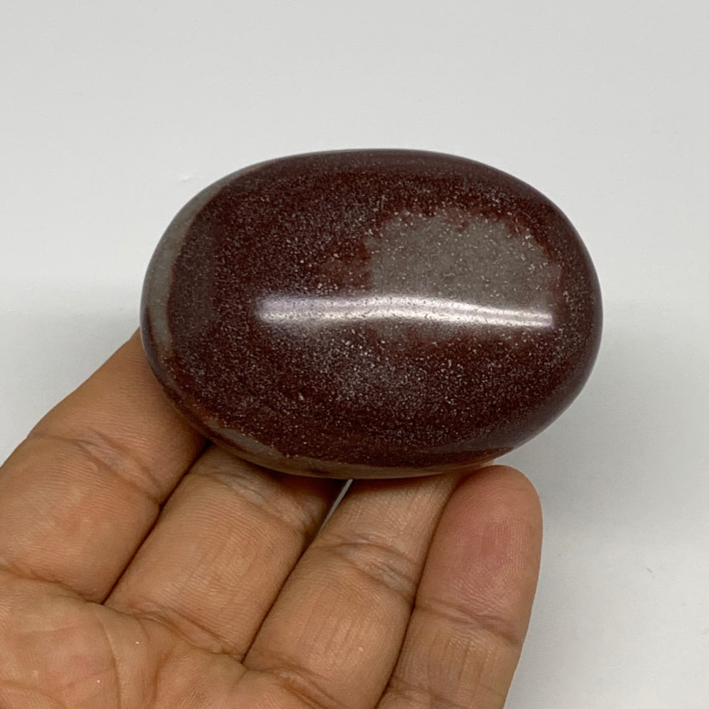 91.2g, 2.3"x1.7"x0.9", Narmada Shiva Lingam Palm-Stone Polished, B29380
