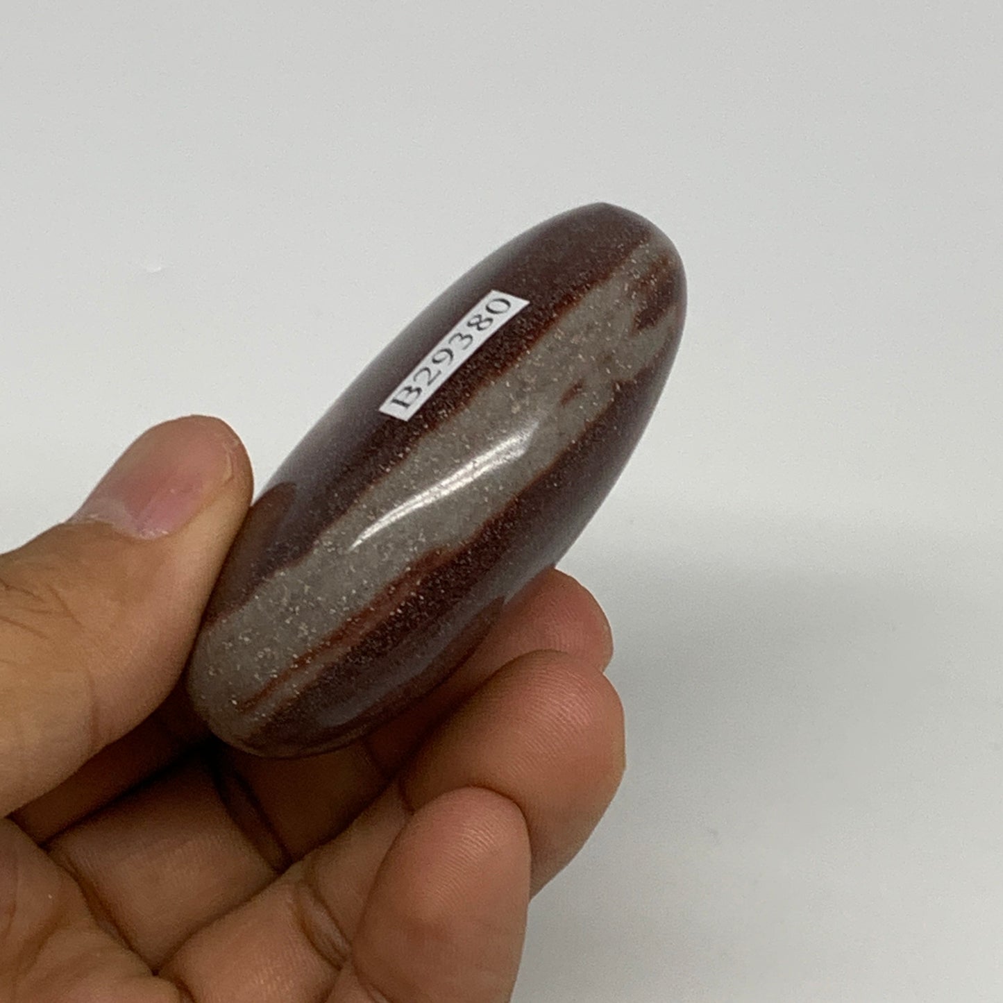 91.2g, 2.3"x1.7"x0.9", Narmada Shiva Lingam Palm-Stone Polished, B29380