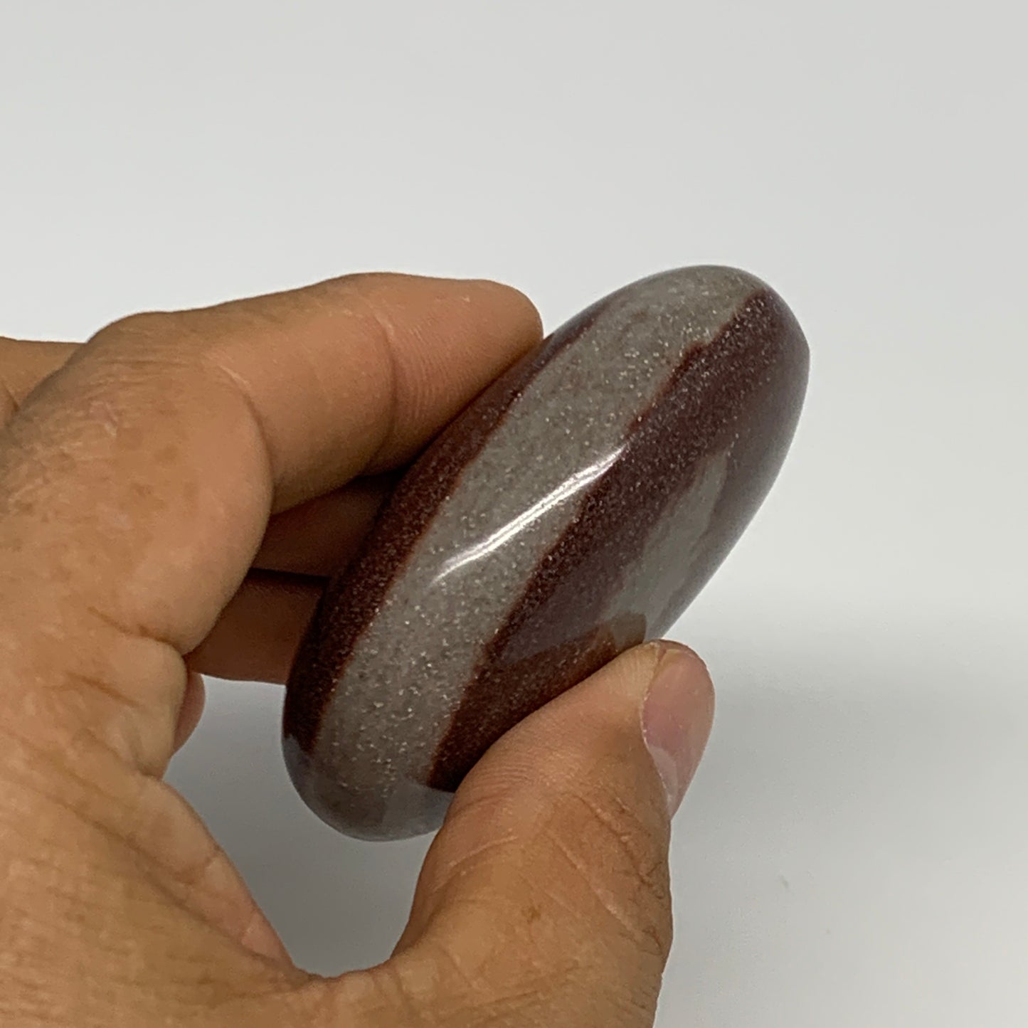 91.2g, 2.3"x1.7"x0.9", Narmada Shiva Lingam Palm-Stone Polished, B29380