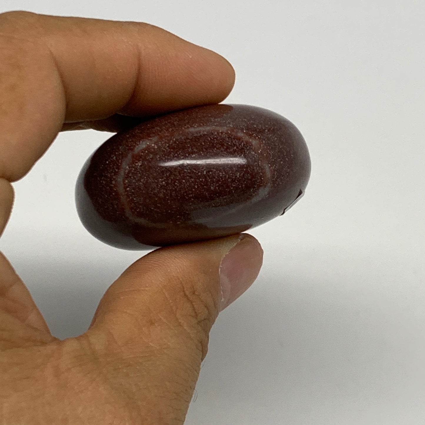 97.4g, 2.3"x1.7"x1", Narmada Shiva Lingam Palm-Stone Polished, B29379