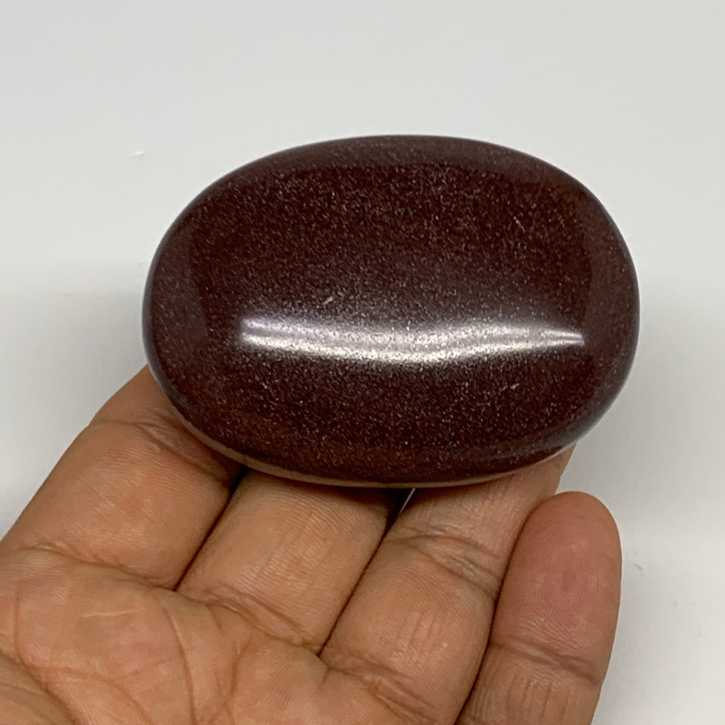 94.9g, 2.4"x1.7"x0.9", Narmada Shiva Lingam Palm-Stone Polished, B29378