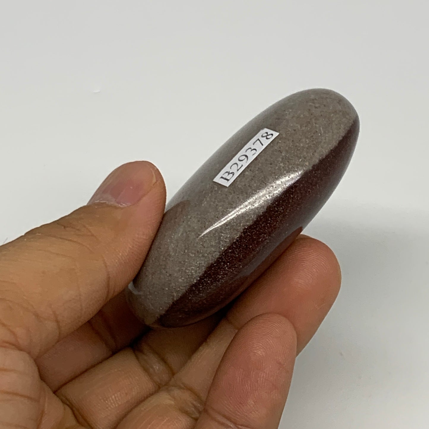 94.9g, 2.4"x1.7"x0.9", Narmada Shiva Lingam Palm-Stone Polished, B29378