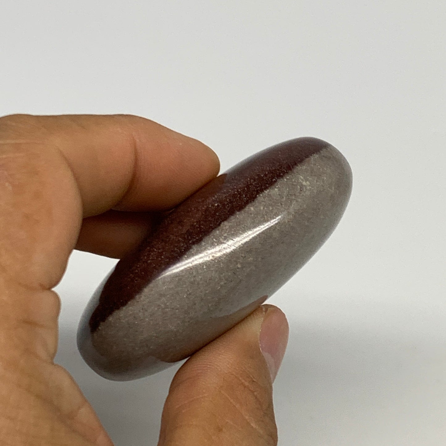 94.9g, 2.4"x1.7"x0.9", Narmada Shiva Lingam Palm-Stone Polished, B29378