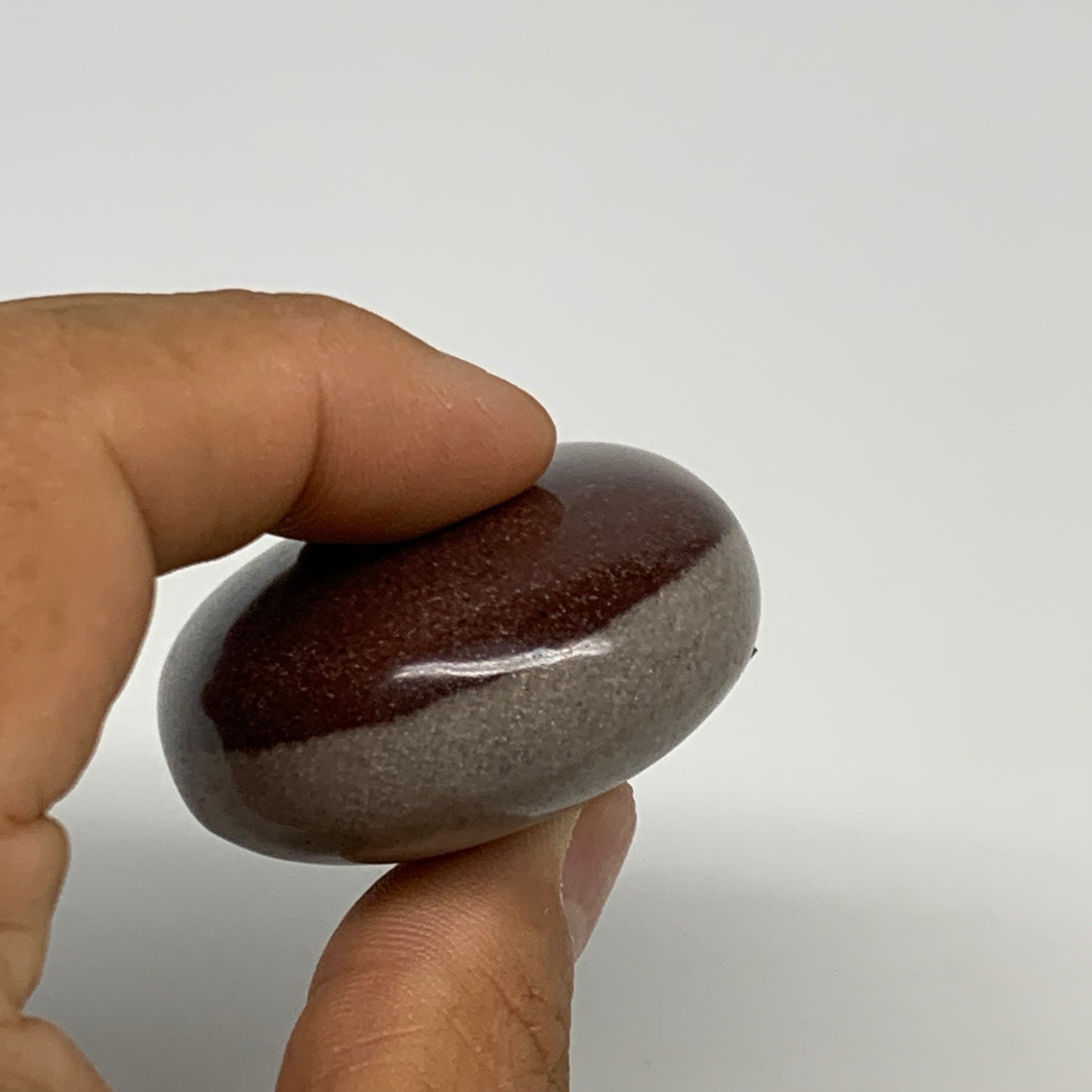 94.9g, 2.4"x1.7"x0.9", Narmada Shiva Lingam Palm-Stone Polished, B29378