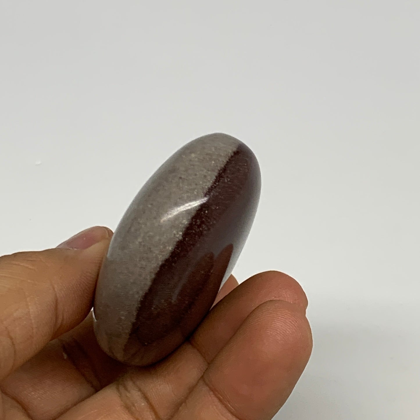 94.9g, 2.4"x1.7"x0.9", Narmada Shiva Lingam Palm-Stone Polished, B29378