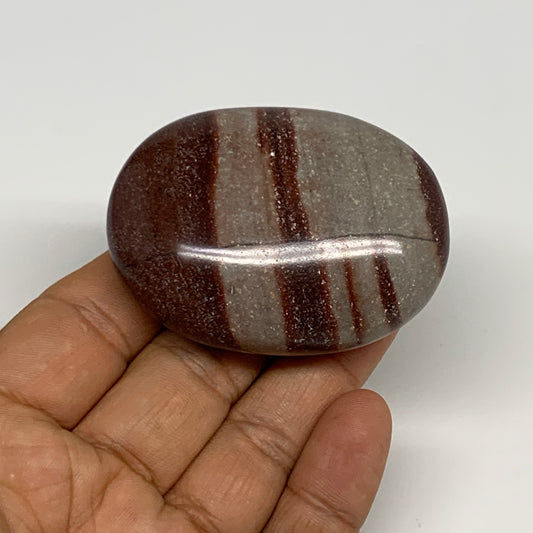 95.8g, 2.3"x1.7"x0.9", Narmada Shiva Lingam Palm-Stone Polished, B29383