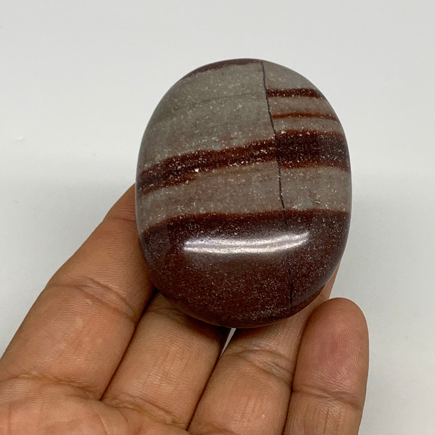 95.8g, 2.3"x1.7"x0.9", Narmada Shiva Lingam Palm-Stone Polished, B29383