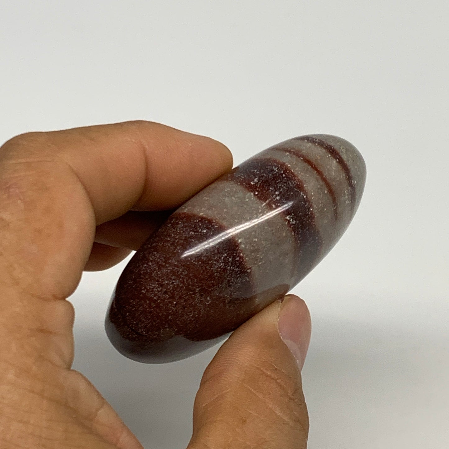 95.8g, 2.3"x1.7"x0.9", Narmada Shiva Lingam Palm-Stone Polished, B29383