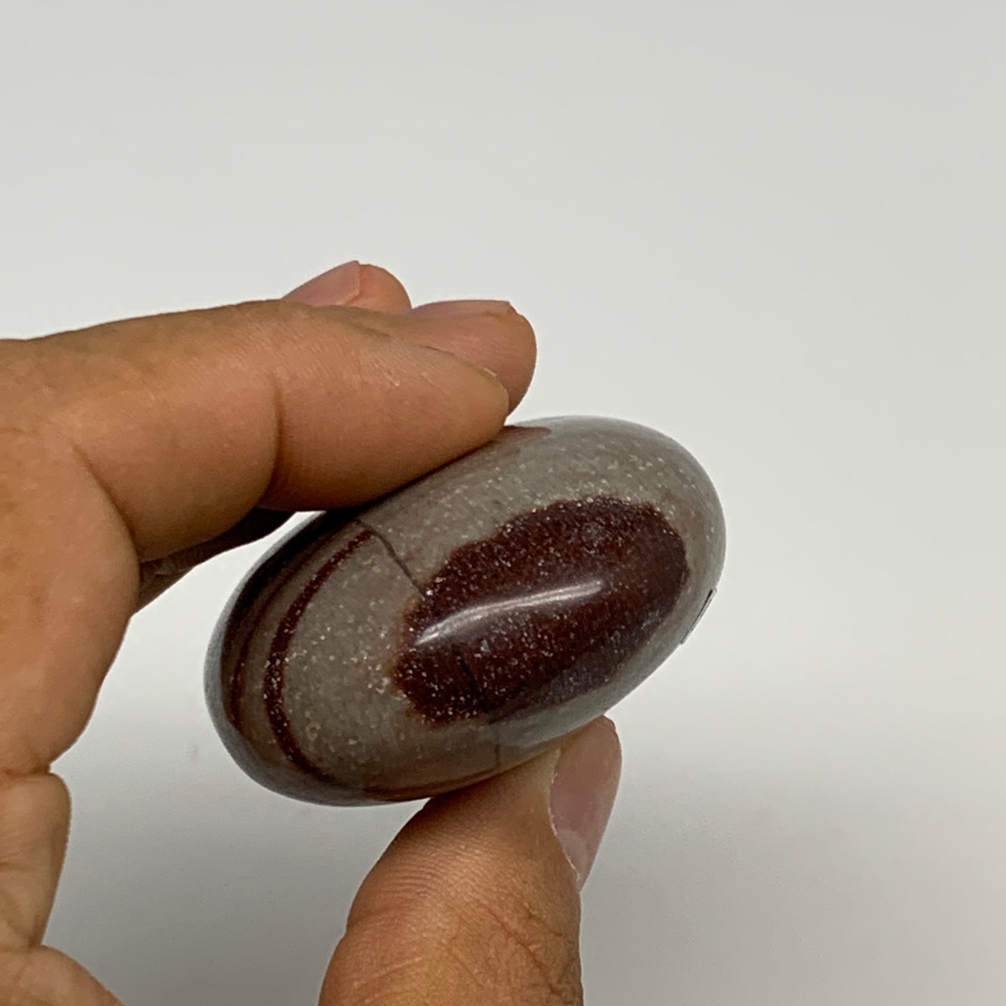95.8g, 2.3"x1.7"x0.9", Narmada Shiva Lingam Palm-Stone Polished, B29383