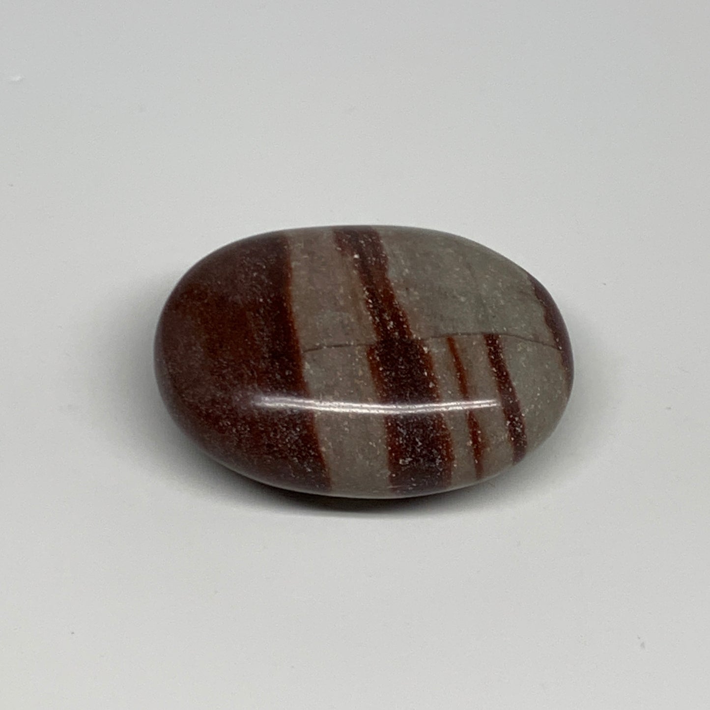 95.8g, 2.3"x1.7"x0.9", Narmada Shiva Lingam Palm-Stone Polished, B29383