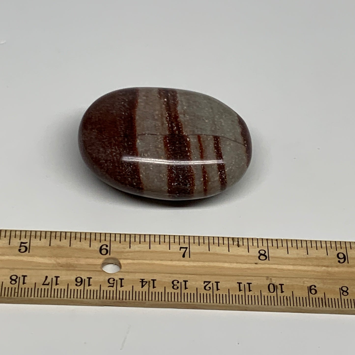 95.8g, 2.3"x1.7"x0.9", Narmada Shiva Lingam Palm-Stone Polished, B29383