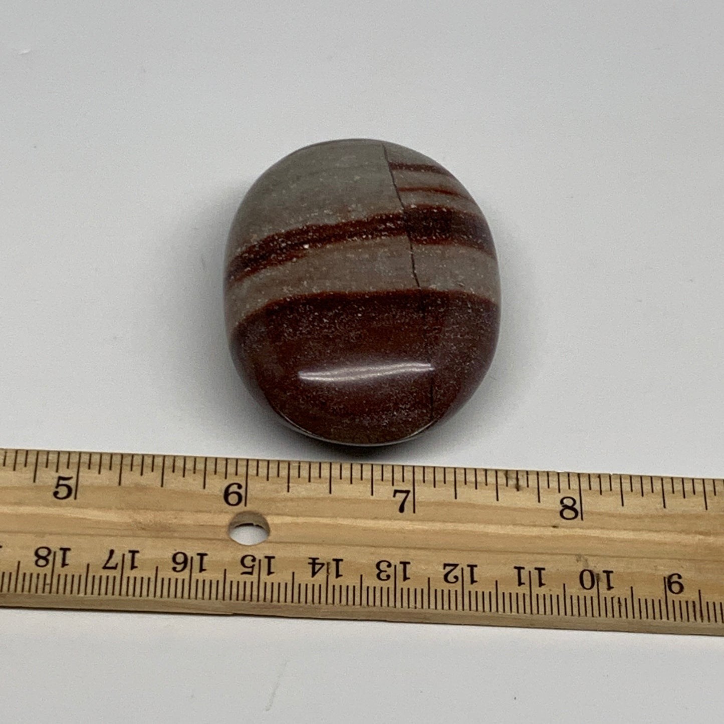 95.8g, 2.3"x1.7"x0.9", Narmada Shiva Lingam Palm-Stone Polished, B29383