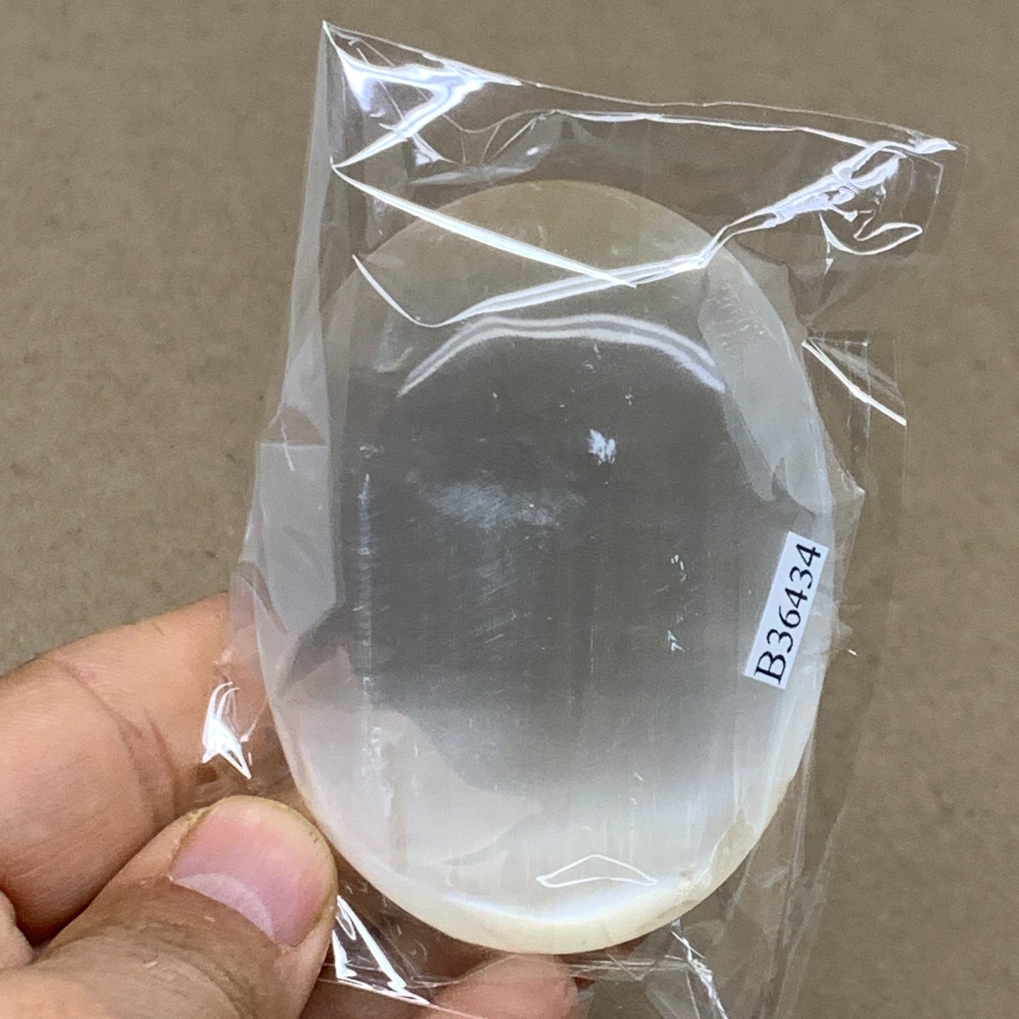 103g, 2.8"x2.1"x0.9", White Selenite Palmstone Crystal Pillow Reiki, B36434