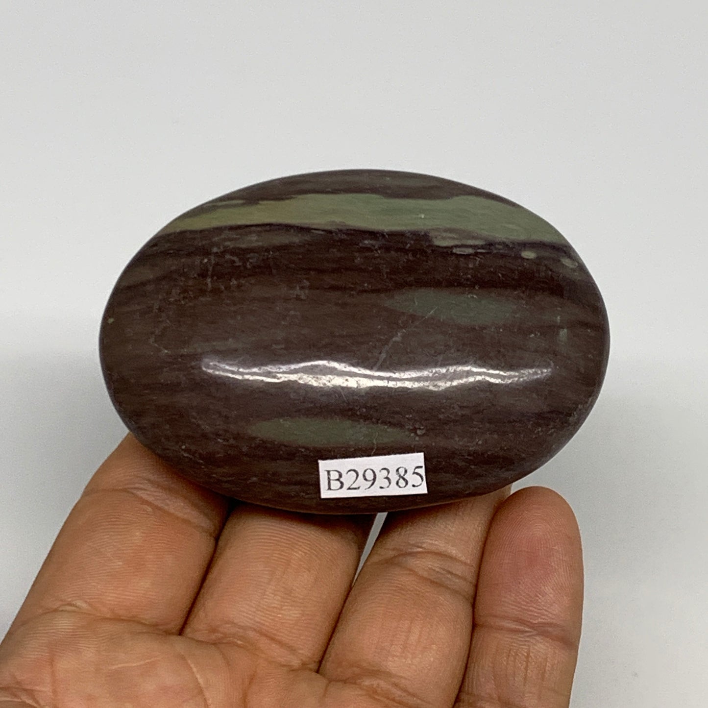 117.1g, 2.8"x2"x0.9", Narmada Shiva Lingam Palm-Stone Polished, B29385