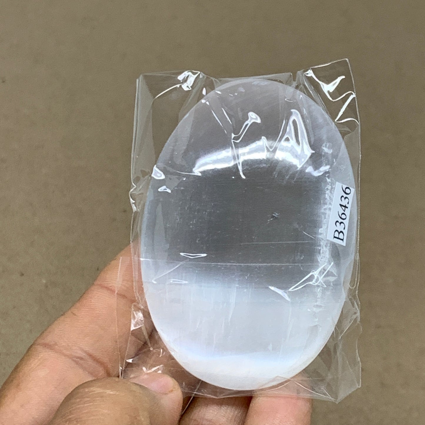 98g, 2.8"x1.9"x1", White Selenite Palmstone Crystal Pillow Reiki, B36436