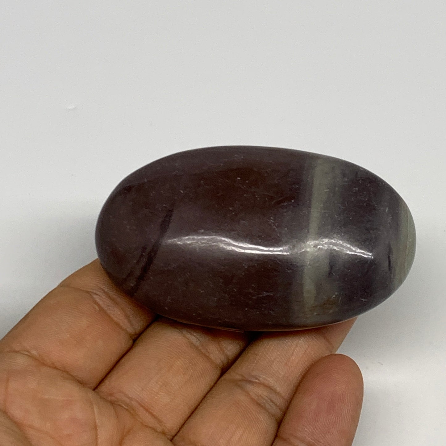 87.8g, 2.6"x1.6"x0.9", Narmada Shiva Lingam Palm-Stone Polished, B29386